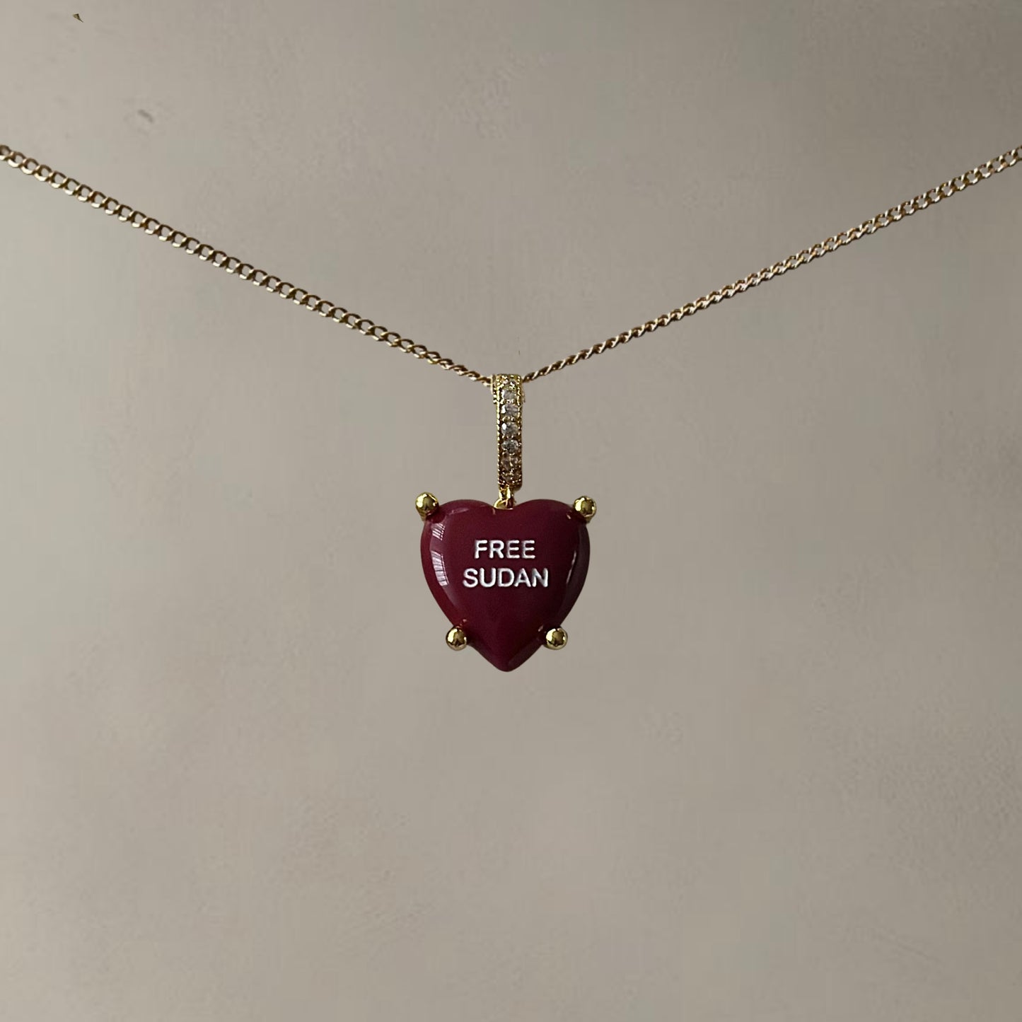 “FREE SUDAN” HEARTSHAPED NECKLACE • CHERRY