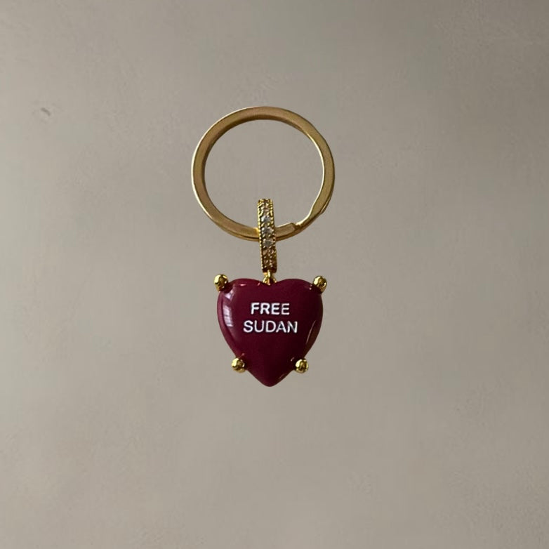 “FREE SUDAN” HEARTSHAPED KEY/BAG CHAIN • CHERRY